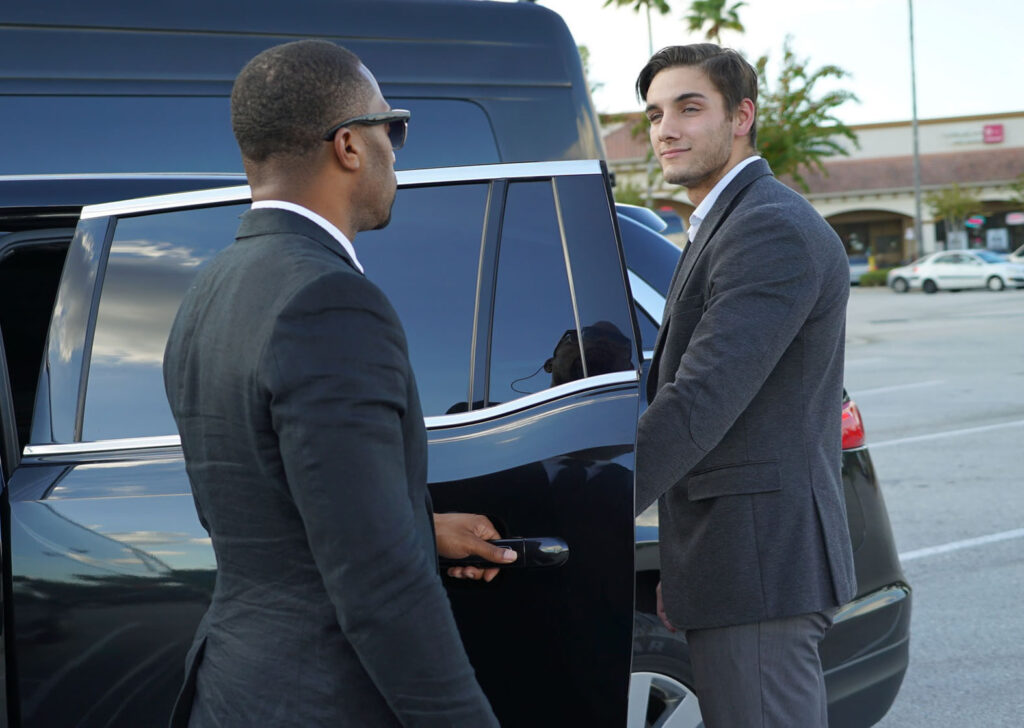 Chauffeur holding the door for a passenger in Chatsworth