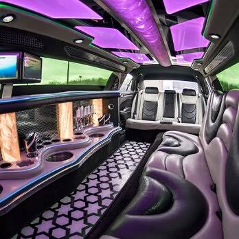 Stretch limousine interior with mood lighting and a bar